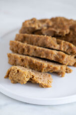 A close shot of a dish with some seitan slices