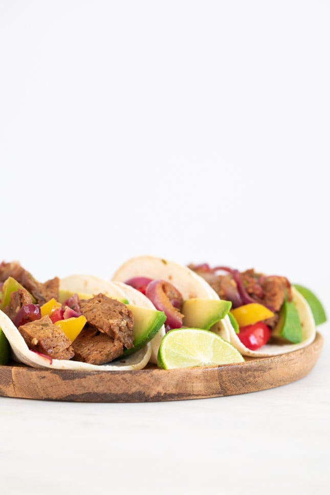 A frontal shot of a dish with vegan fajitas