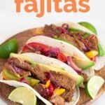 A shot of a plate with vegan fajitas served in tortillas