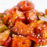 Side photo of a plate of sweet and sour tofu witht the words sweet and sour tofu
